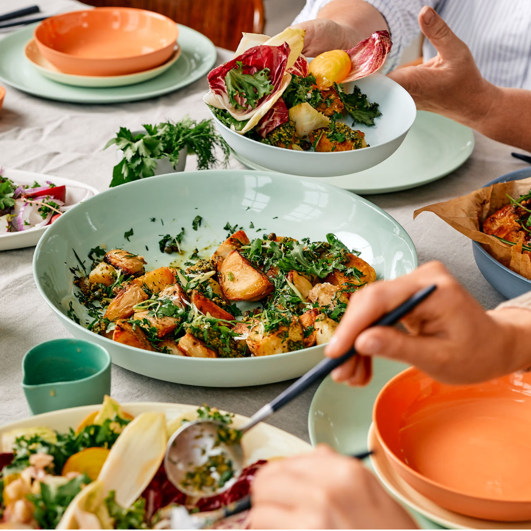 Serving pieces from mud australia at the dinner table