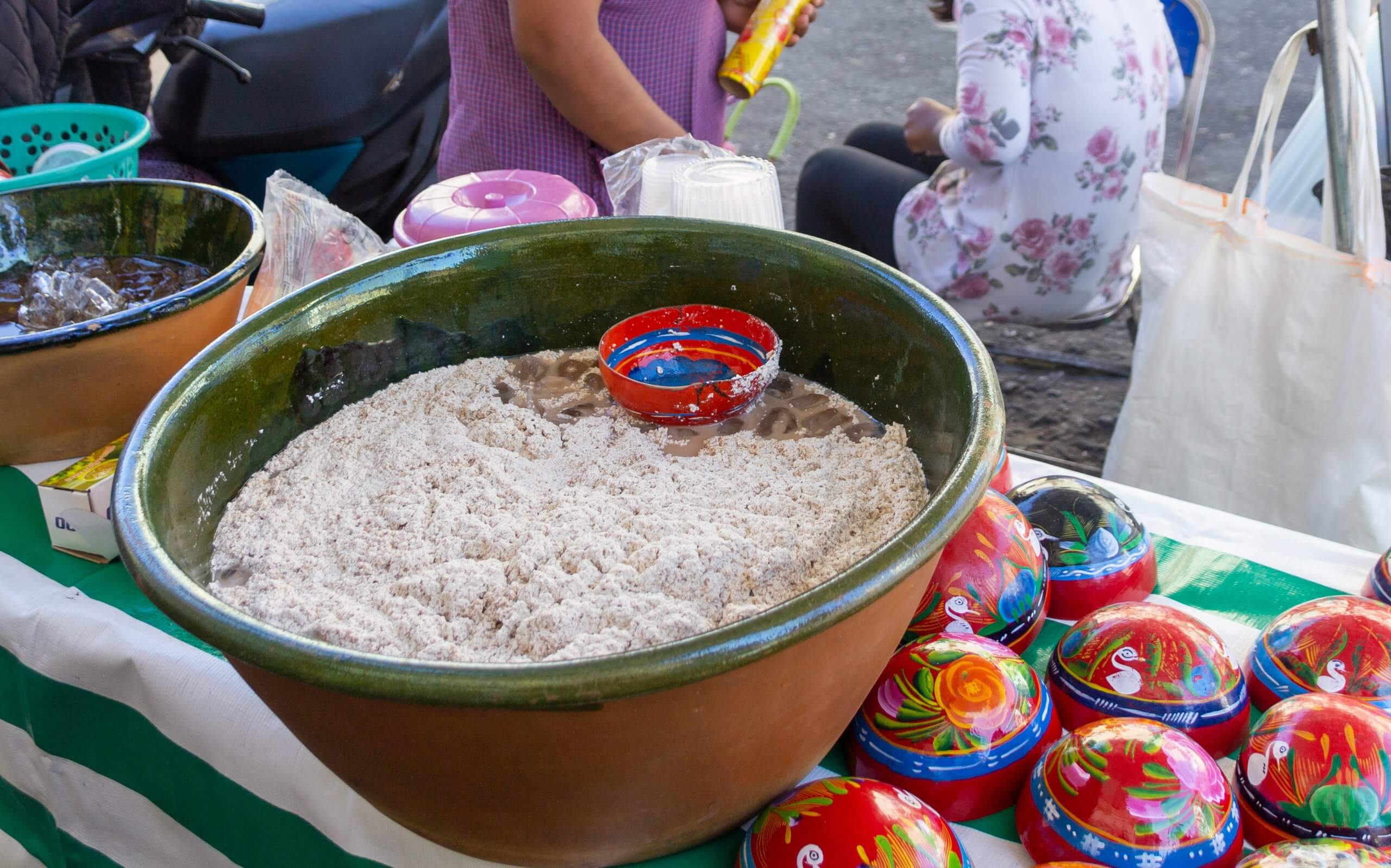 Large bowl of tejate in a market setting