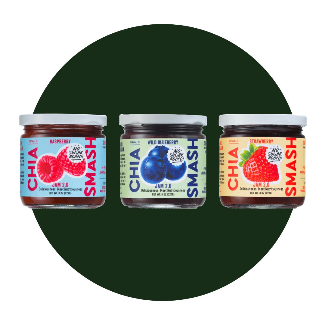 Three jars of fruit spreads on a dark green circle