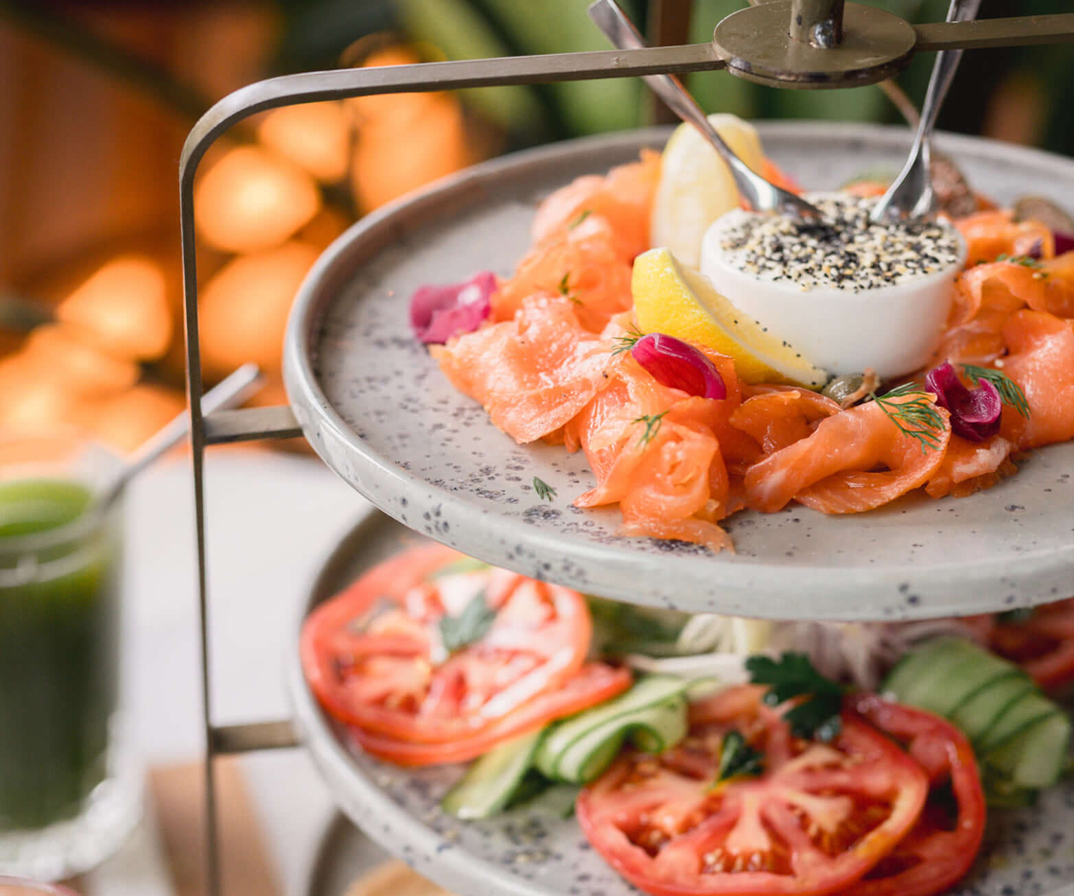 A closeup of seafood and brunch items on a standing tray