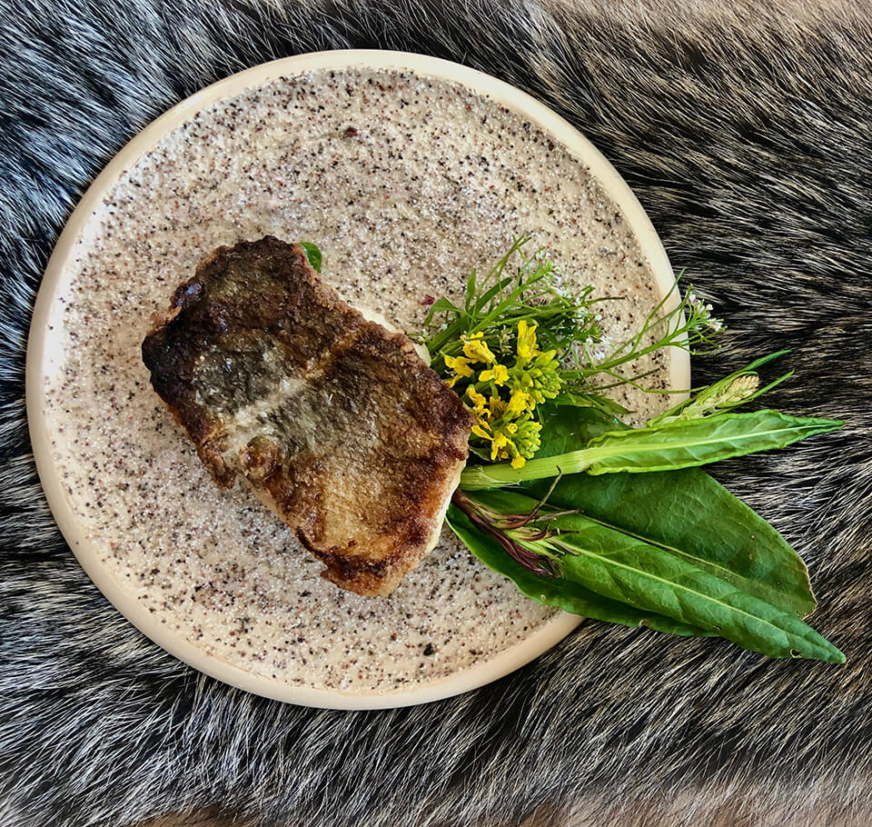 A dish of food on a fur