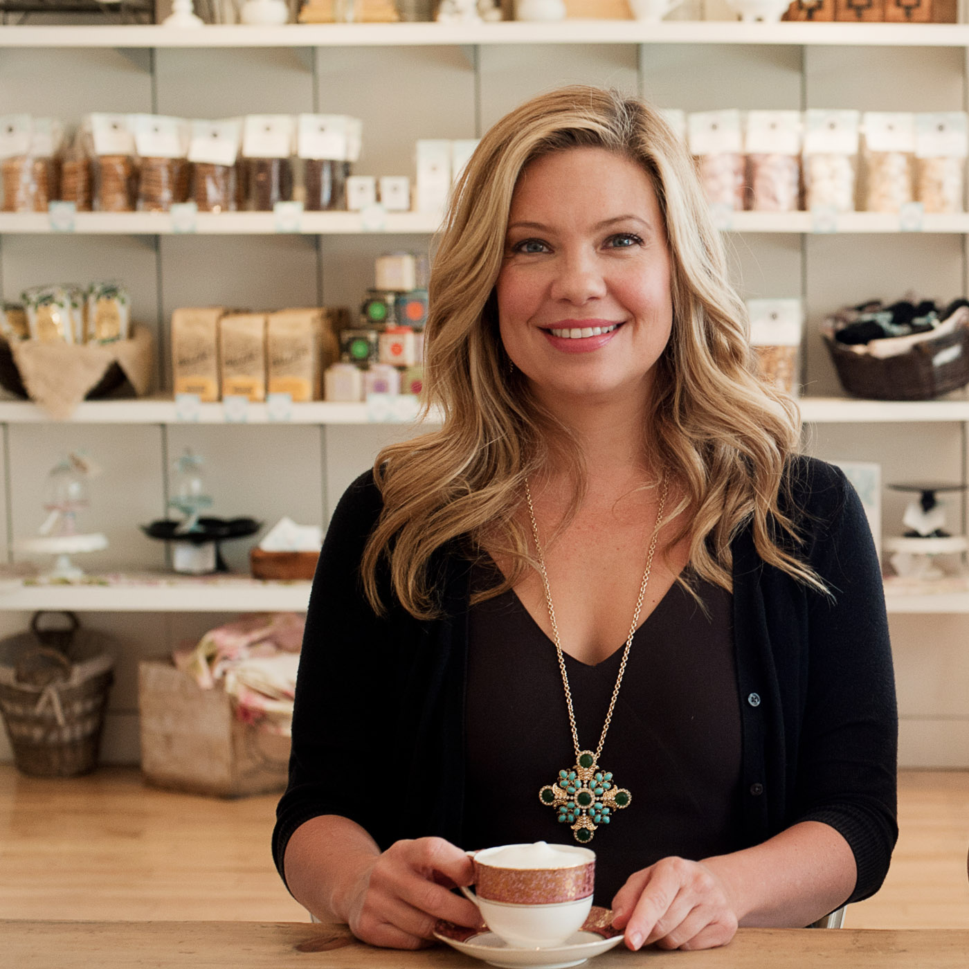 Portrait of Allyson Bobbitt standing in her bakery Bobbitt & Belle