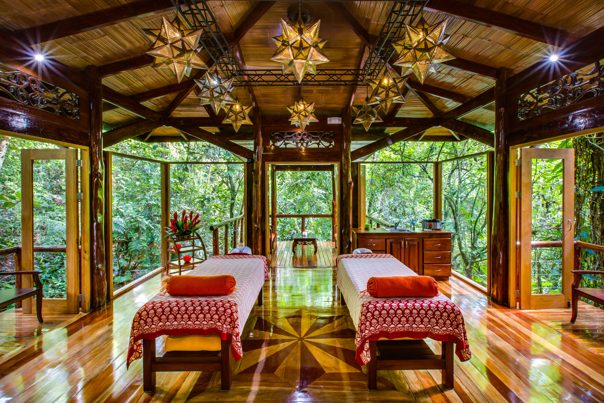 two matching massage tables in a screened in porch