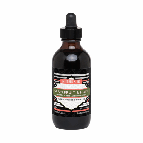 A bottle of bitters with a black dropper cap.