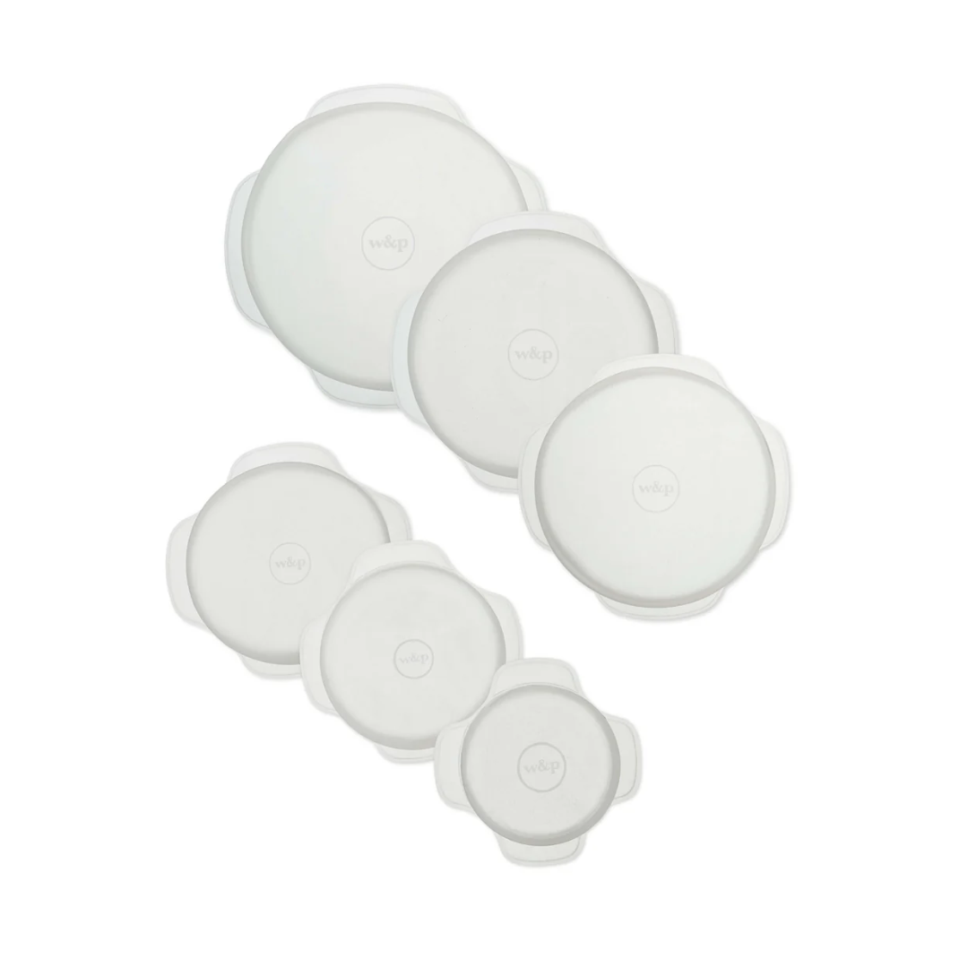 Six clear round silicone lids.