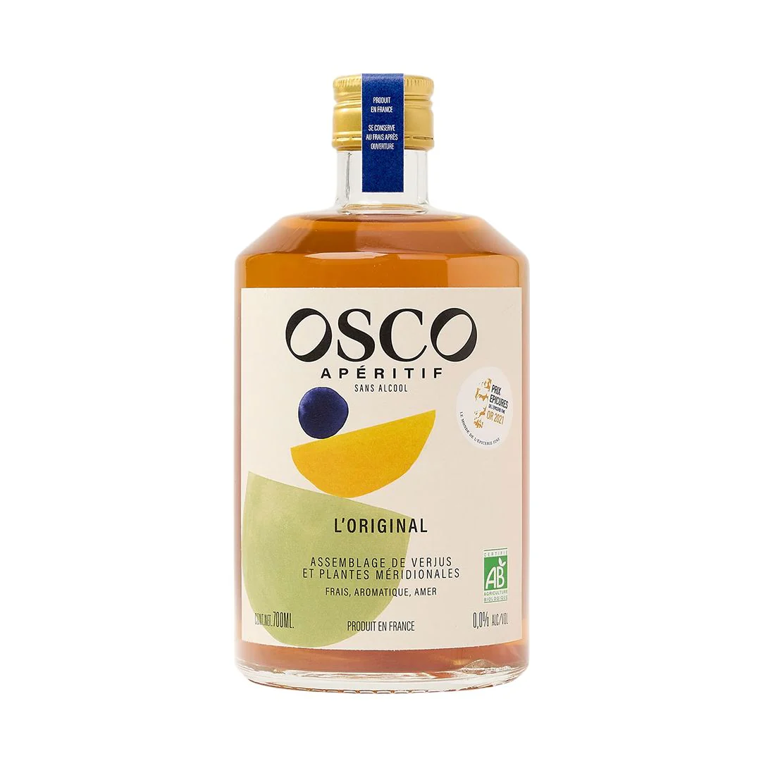 Bottle of orange aperitif with a gold cap and tan label. 
