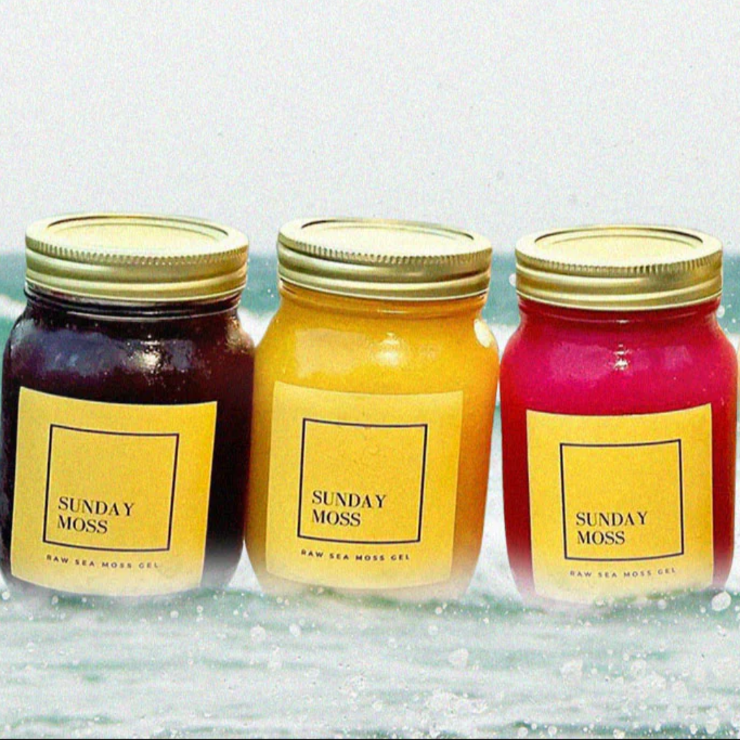 A jar of purple sea moss, yellow sea moss and pink sea moss.