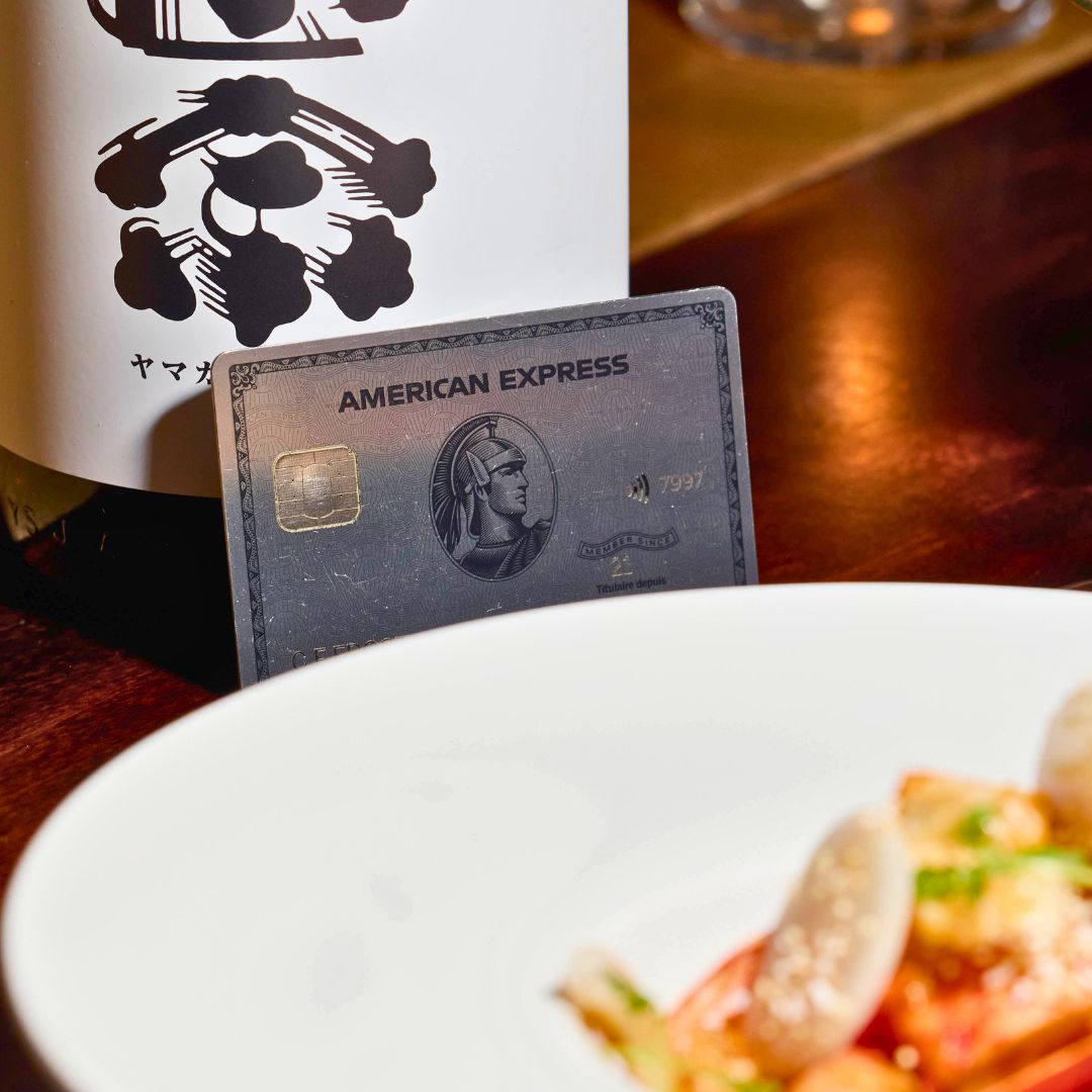 American Express Platinum Card beside bowl of food