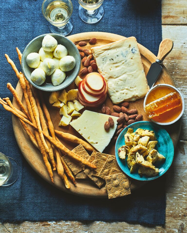 A selection of italian cheeses on a cheeseboard