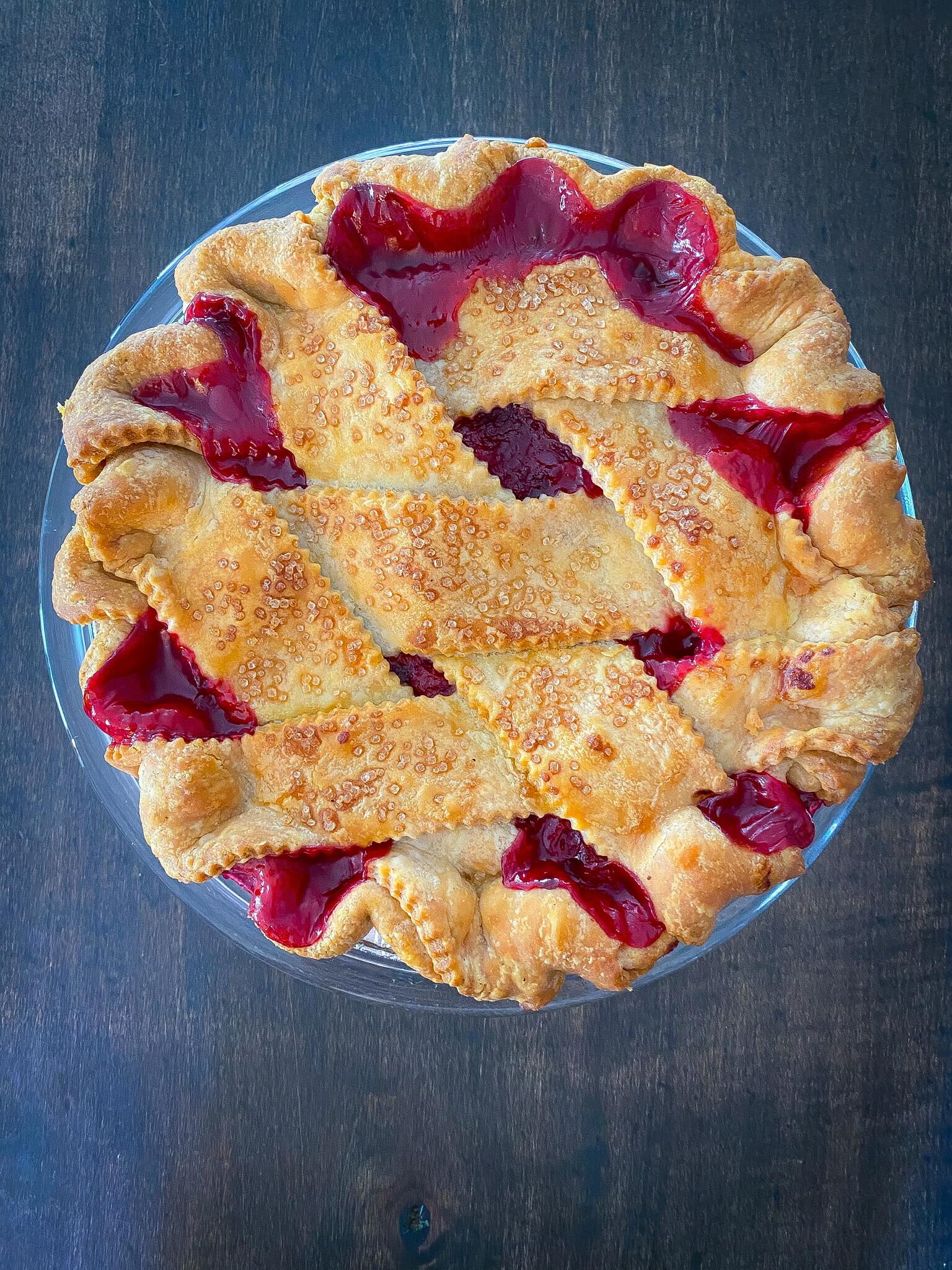 Overhead image of a raspberry pie made in niagara with beautiful lattice pastry
