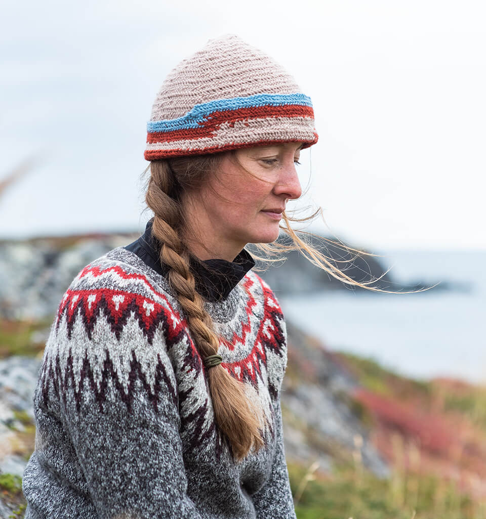 A woman in a wool sweater and hat