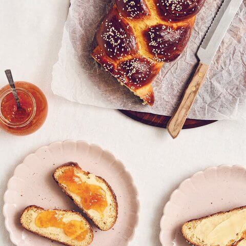 Slices of Greek Easter bread spread with marmalade