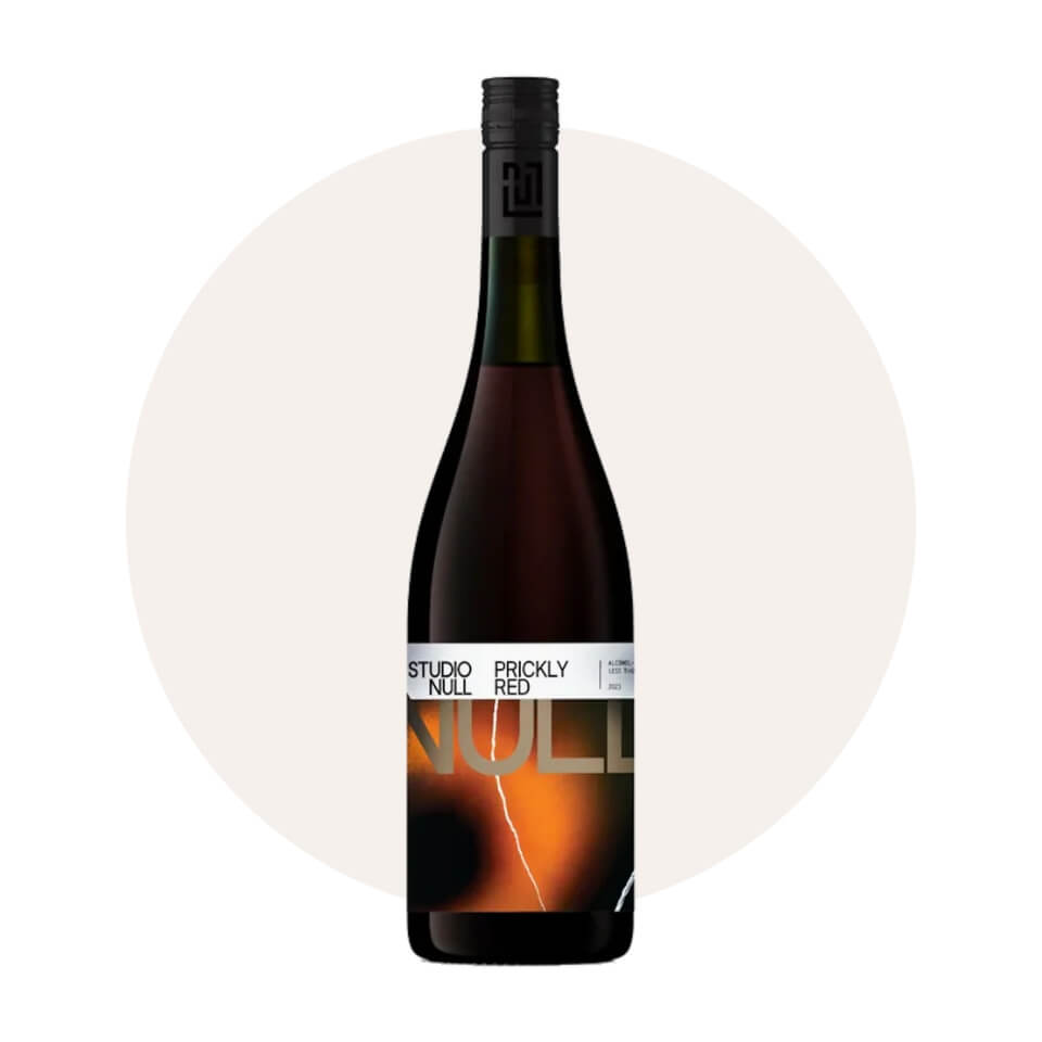 A bottle of red wine over a cream-coloured circle