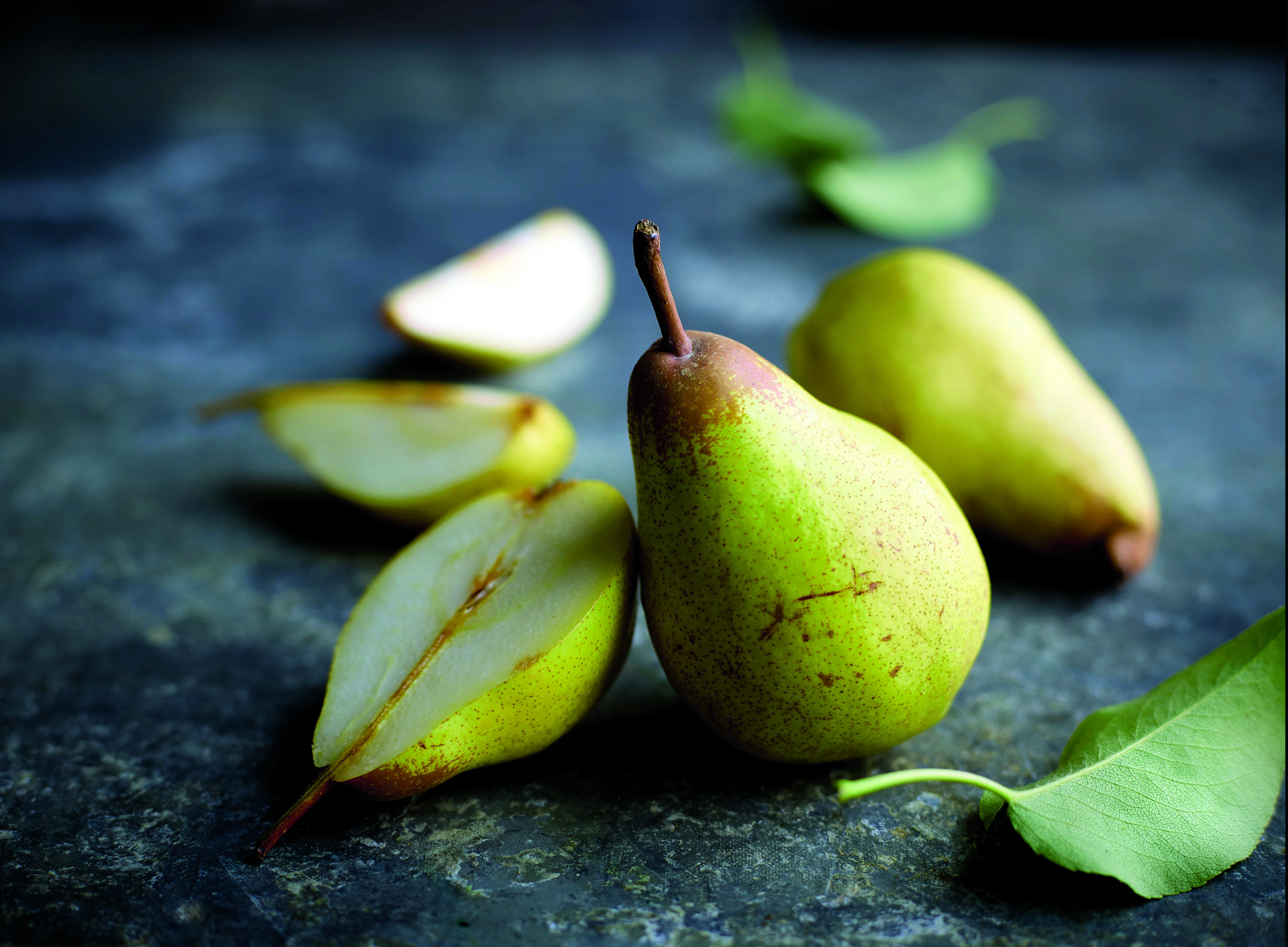 Pêra Rocha do Oeste are pears from spain and are similar to Bosc Pears. This image has pears cut to show delicious juiciness.