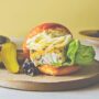 Halibut burger topped with fennel slaw, citrus mayo and blueberry relish on a toasted bun
