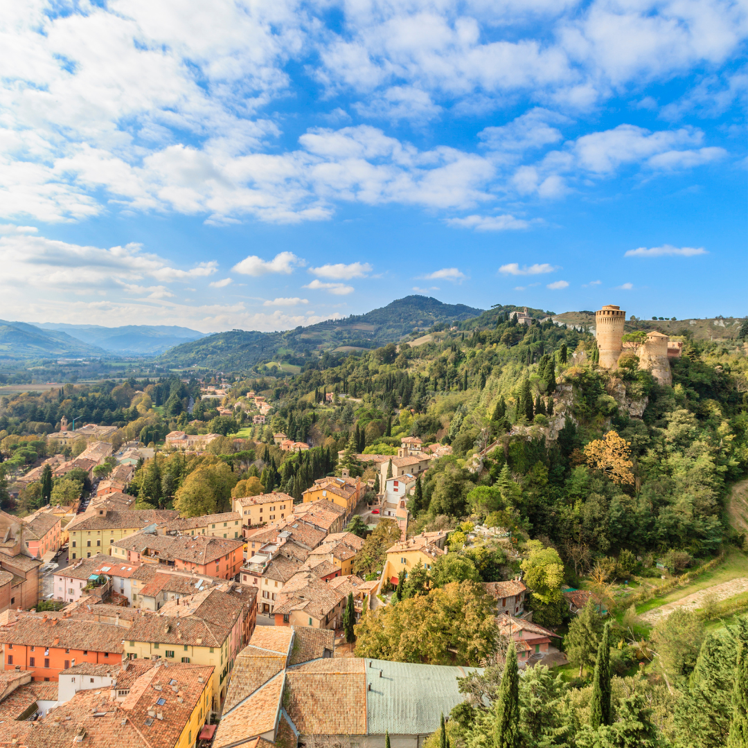 landscape of mountains and italian homes in Emilia Romagna, Italy where Parmigiano Reggiano is made