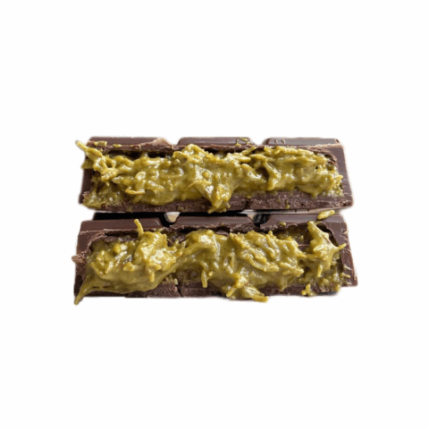 A chocolate bar split in half and stacked to show a pistachio knafeh filling.