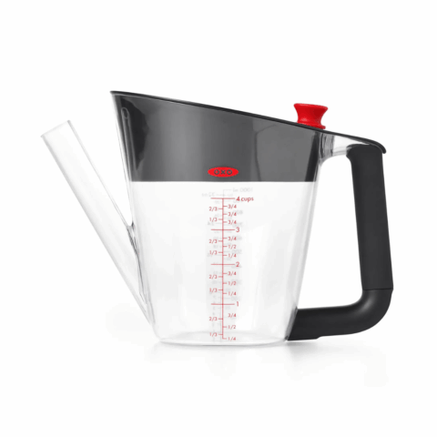 A large clear fat separator with a long spout and a black handle.
