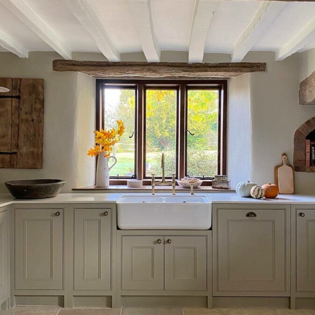 A charming british cottage kitchen painted in Farrow & Ball Light Grey