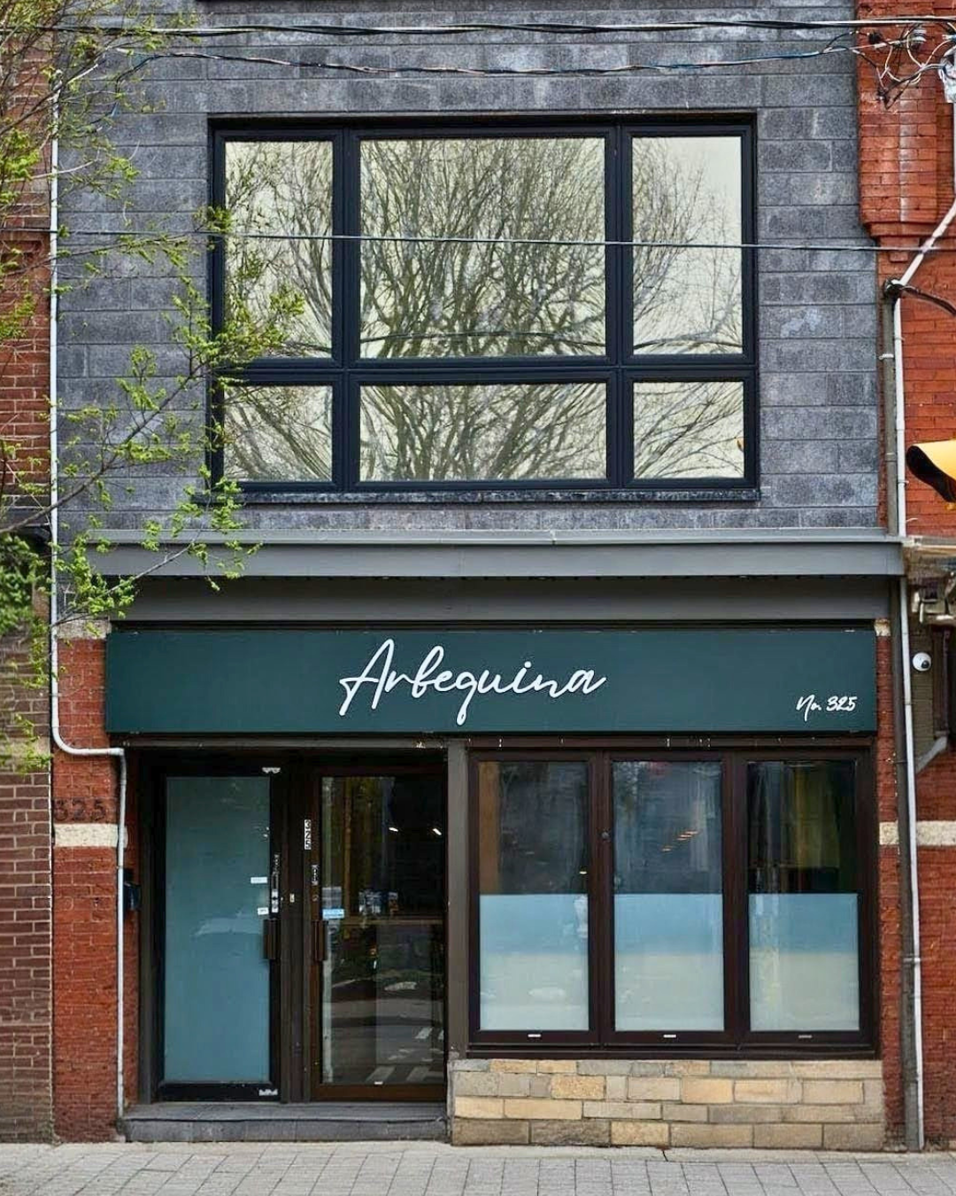 Exterior of Arbequina, the MICHELIN-selected restaurant from Chef Moeen AbuZaid in Toronto’s Roncesvalles neighbourhood