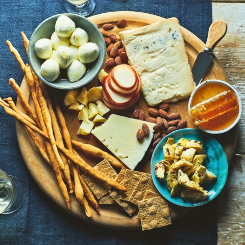 A selection of italian cheeses on a cheeseboard
